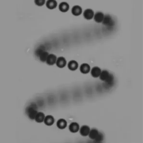Helical trajectory of spherical particles in 3D. 